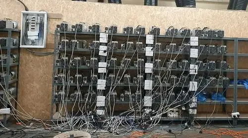 A modern mining farm optimized for Kaspa, showcasing rows of mining rigs